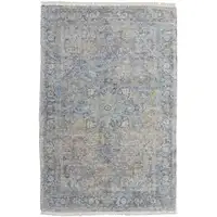 Photo of Gray Blue and Tan Abstract Hand Woven Distressed Area Rug With Fringe