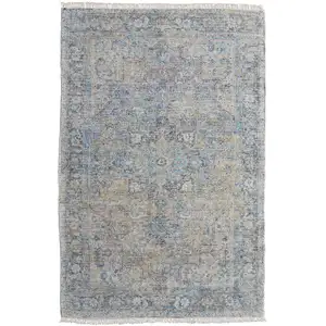 Photo of Gray Blue and Tan Abstract Hand Woven Distressed Area Rug With Fringe