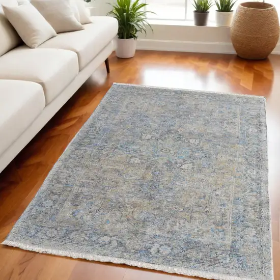 Gray Blue and Tan Abstract Hand Woven Distressed Area Rug With Fringe Photo 1