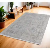 Photo of Gray Blue and Taupe Abstract Hand Woven Distressed Area Rug With Fringe