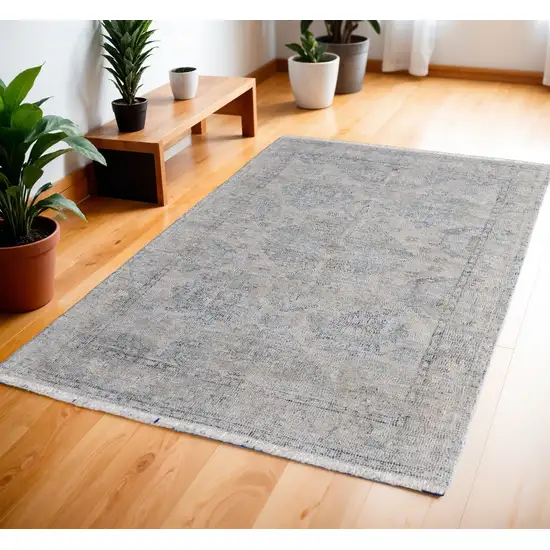 Gray Blue and Taupe Abstract Hand Woven Distressed Area Rug With Fringe Photo 1