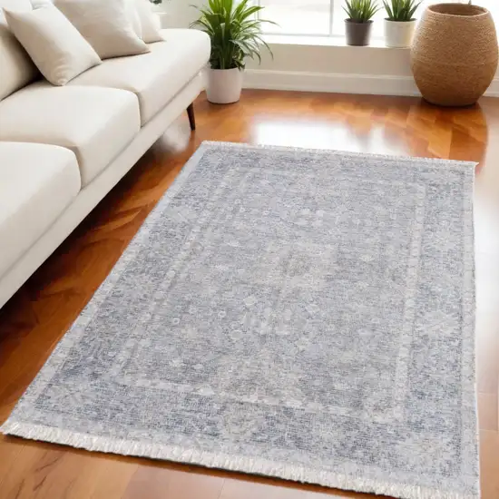 Gray Blue and Taupe Abstract Hand Woven Distressed Area Rug With Fringe Photo 1