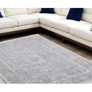 Photo of Gray Blue and Taupe Abstract Hand Woven Distressed Area Rug With Fringe