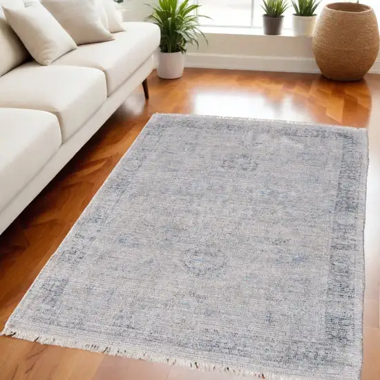 Gray Blue and Taupe Abstract Hand Woven Distressed Area Rug With Fringe Photo 1