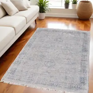 Photo of Gray Blue and Taupe Abstract Hand Woven Distressed Area Rug With Fringe