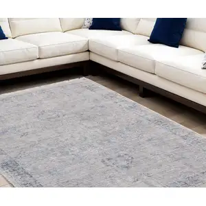 Photo of Gray Blue and Taupe Abstract Hand Woven Distressed Area Rug With Fringe