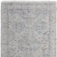 Photo of Gray Blue and Taupe Oriental Hand Woven Distressed Area Rug With Fringe