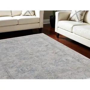 Photo of Gray Blue and Taupe Oriental Hand Woven Distressed Area Rug With Fringe