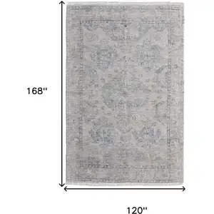 Photo of Gray Blue and Taupe Oriental Hand Woven Distressed Area Rug With Fringe