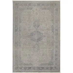 Photo of Gray Blue and Taupe Oriental Power Loom Worn Faded Area Rug With Fringe