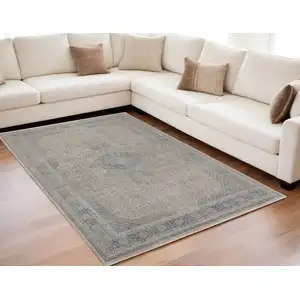 Photo of Gray Blue and Taupe Oriental Power Loom Worn Faded Area Rug With Fringe