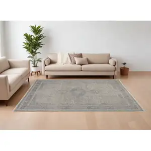 Photo of Gray Blue and Taupe Oriental Power Loom Worn Faded Area Rug With Fringe