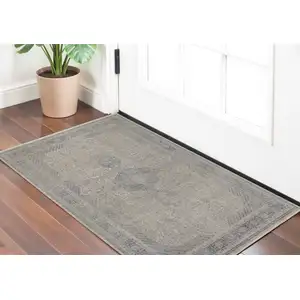 Photo of Gray Blue and Taupe Oriental Power Loom Worn Faded Area Rug With Fringe