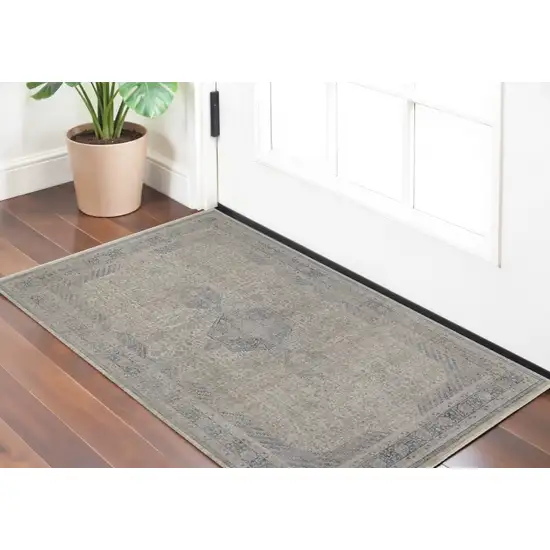 Gray Blue and Taupe Oriental Power Loom Worn Faded Area Rug With Fringe Photo 1