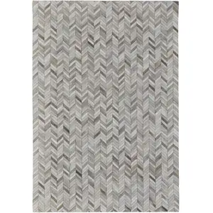 Photo of Gray Brown and Ivory Faux Cowhide Animal Print Power Loom Area Rug