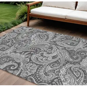 Photo of Gray Charcoal And Ivory Paisley Washable Indoor Outdoor Area Rug