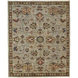 Photo of Gray Gold And Red Wool Floral Hand Knotted Stain Resistant Area Rug With Fringe