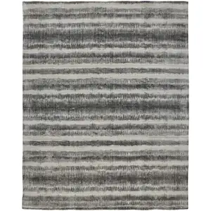 Photo of Gray Ivory And Black Abstract Hand Woven Area Rug