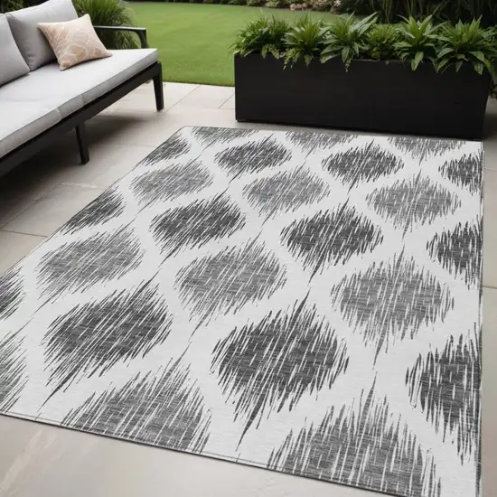 Gray Ivory And Charcoal Ikat Washable Indoor Outdoor Area Rug Photo 1