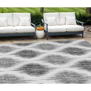 Photo of Gray Ivory And Charcoal Ikat Washable Indoor Outdoor Area Rug