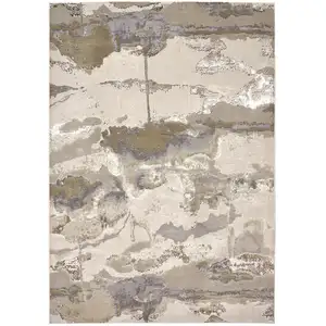 Photo of Gray Ivory And Gold Abstract Area Rug