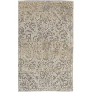 Photo of Gray Ivory And Gold Floral Power Loom Distressed Area Rug