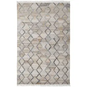 Photo of Gray Ivory And Tan Geometric Hand Woven Stain Resistant Area Rug With Fringe