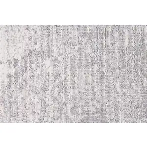 Photo of Gray Ivory And Taupe Abstract Distressed Area Rug With Fringe