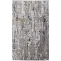 Photo of Gray Ivory and Gold Abstract Power Loom Area Rug With Fringe