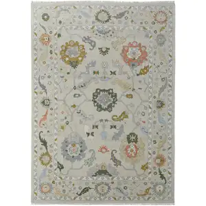 Photo of Gray Ivory and Gold Wool Floral Hand Knotted Area Rug With Fringe