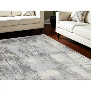 Photo of Gray Ivory and Light Blue Abstract Non Skid Area Rug