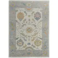 Photo of Gray Ivory and Orange Wool Floral Hand Knotted Area Rug With Fringe