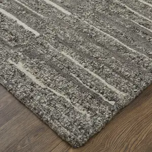 Photo of Gray Ivory and Taupe Abstract Hand Woven Area Rug