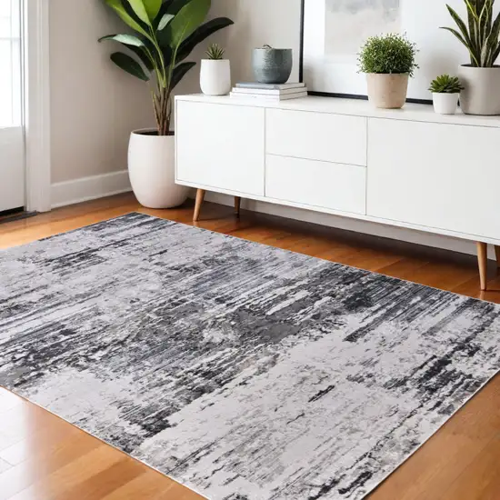 Gray Ivory and Taupe Abstract Power Loom Worn Faded Area Rug Photo 1