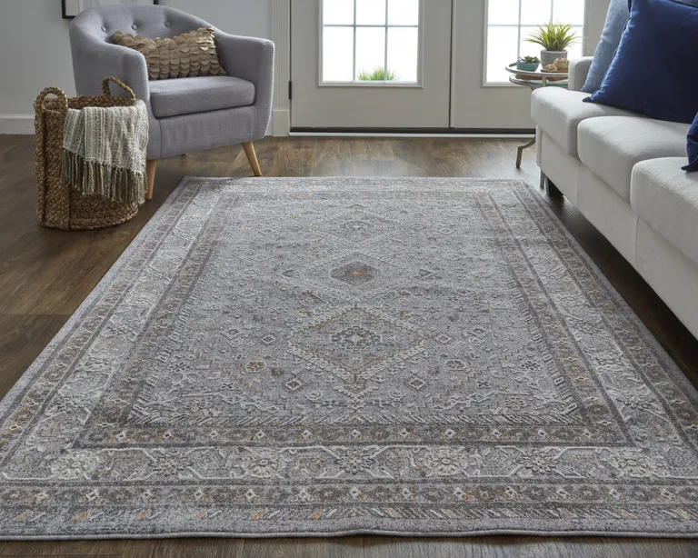 Gray Orange And Ivory Floral Power Loom Stain Resistant Area Rug Photo 1