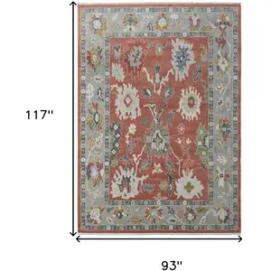 Photo of Gray Red and Ivory Wool Floral Hand Knotted Area Rug With Fringe