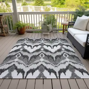 Photo of Gray Silver And Charcoal Ikat Washable Indoor Outdoor Area Rug