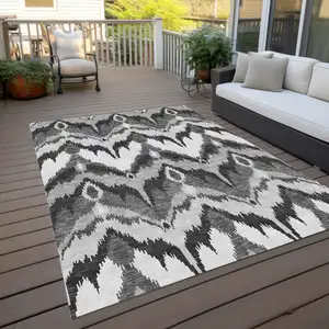 Photo of Gray Silver And Charcoal Ikat Washable Indoor Outdoor Area Rug