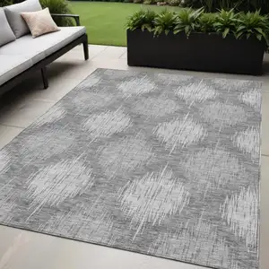 Photo of Gray Silver And Charcoal Ikat Washable Indoor Outdoor Area Rug