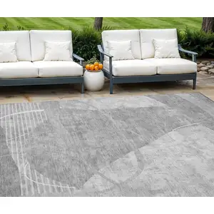 Photo of Gray Silver And Ivory Abstract Washable Indoor Outdoor Area Rug