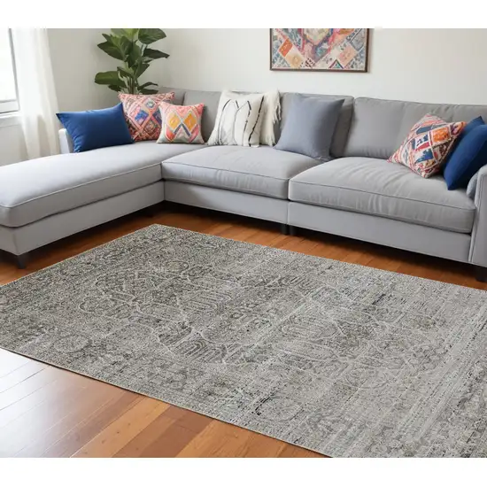 Gray Silver And Taupe Floral Power Loom Distressed Area Rug Photo 1