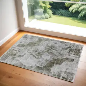 Photo of Gray Silver and Green Ikat Power Loom Area Rug With Fringe