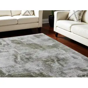 Photo of Gray Silver and Green Ikat Power Loom Area Rug With Fringe