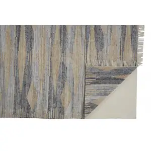 Photo of Gray Tan And Silver Abstract Hand Woven Stain Resistant Area Rug With Fringe