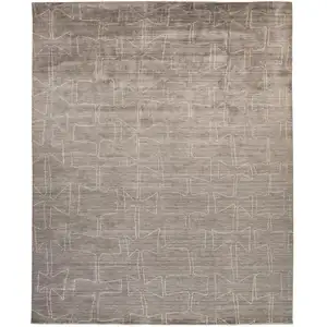 Photo of Gray Taupe And Ivory Abstract Hand Woven Area Rug