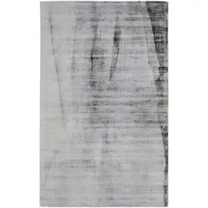 Photo of Gray Taupe And Ivory Abstract Hand Woven Area Rug