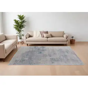 Photo of Gray Taupe and Blue Abstract Hand Tufted Area Rug