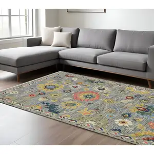 Photo of Gray Yellow And Blue Oriental Area Rug With Fringe