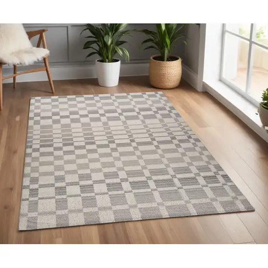 Gray and Beige Checkered Distressed Area Rug Photo 1