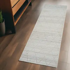 Photo of Gray and Beige Geometric Distressed Area Rug